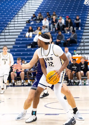 Marlon Williams playing basketball at UIS