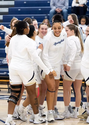 Women's basketball celebratory huddle