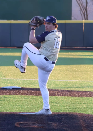 Isaac Graf  pitching in gold UIS uniform