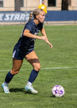 Mallory Herber playing soccer