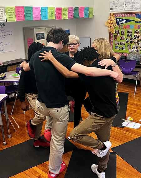 Jennifer Martin teaches students yoga