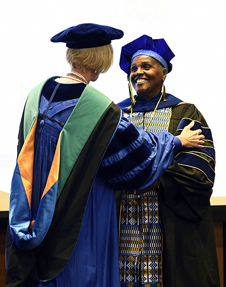 Hoff receives the Presidential Professor medallion.