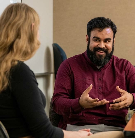 UIS employees talking in an image used to promote UIS Lunch N Learn event happening November 29