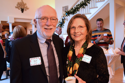 A man and woman posing together for a photo. 