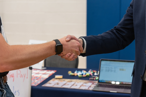 two people shaking hands