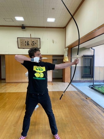 Brandon Rapps shooting a traditional Japanese bow and arrow.