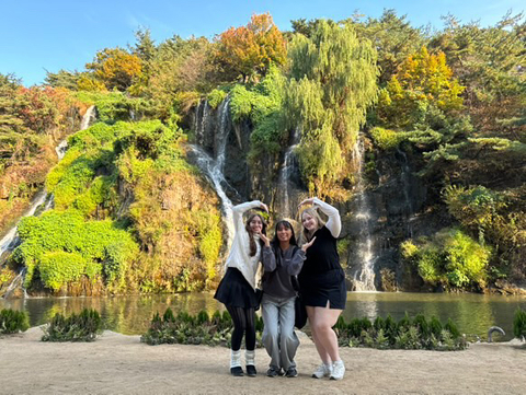 Friends posing on a hike.