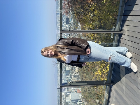 Mackenzie Bateman in front of a skyline.