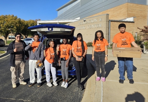 Necessary Steps students in front of TRAC posing for a photo.