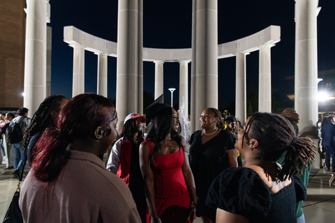 graduates in front of colonnade