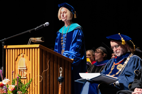 Chancellor Gooch speaking on stage