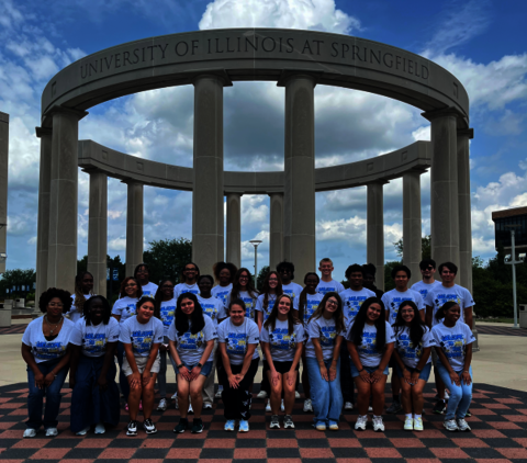 2025/2026 Resident Assistants posing in front of the colonnade.