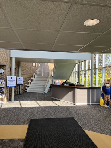 Inside Illinois Central College, including the front desk and stairs that lead to the third floor.