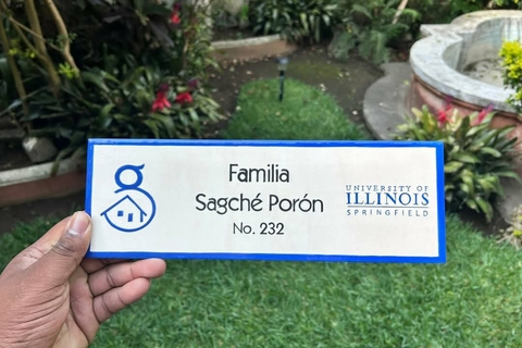A plaque with “Familia Sagché Porón No. 232” and the University of Illinois Springfield logo.