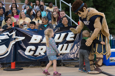 UIS mascot having fun with a kid