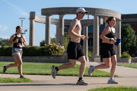 Three people running in the Prairie Star 5K.