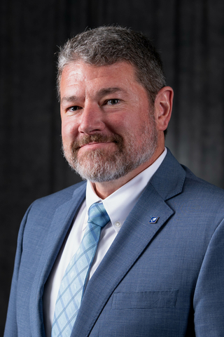 Brandon Schwab head-and-shoulders photo in business attire