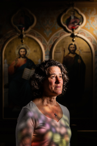 Portrait of Heather Bailey by Clay Stalter in a church setting with light from above.