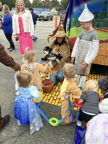 children at the Athletic Department entry