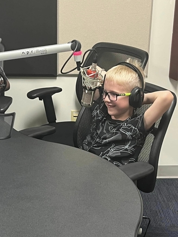 child being interviewed on WUIS radio