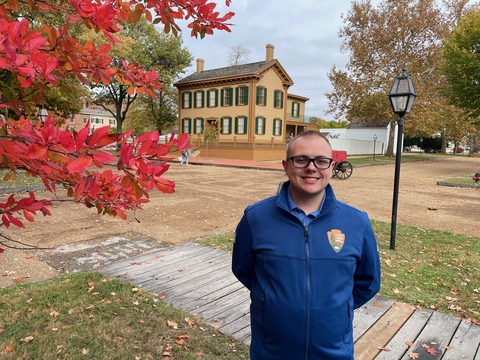 Center for Lincoln Studies intern Evan Keeney stands in front of the Lincoln Home.