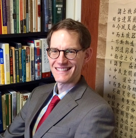 Dr. Graham Peck sitting in an office smiling.