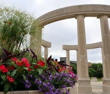 Flowers and colonnade on UIS' campus