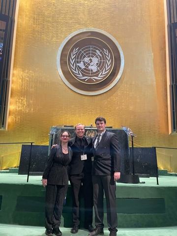 UIS students in front of the rostrum inside the UN General Assembly Hall.