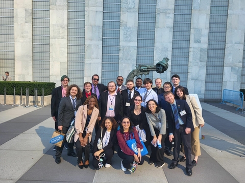 UIS Students outside the UN Building in front of the sculpture Non-Violence