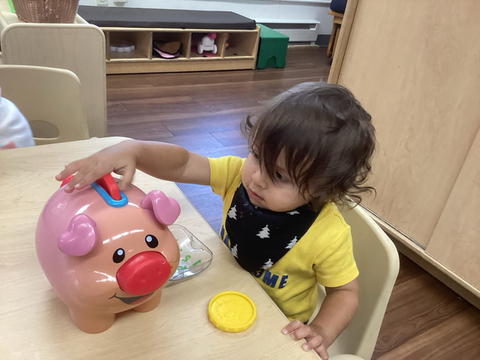 child learning about coins