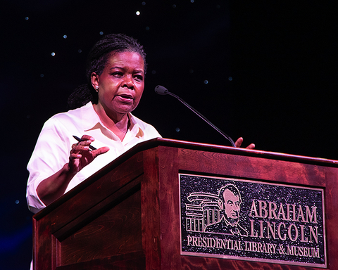 Close-up of Annette Gordon Reed at a podium