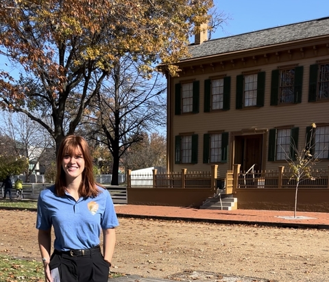 Center for Lincoln Studies intern Nadia Wilson stands in front of the Lincoln Home.