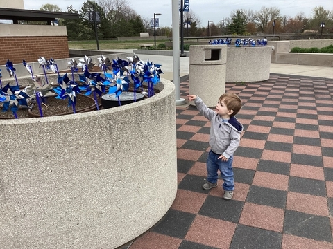 child with pinwheels