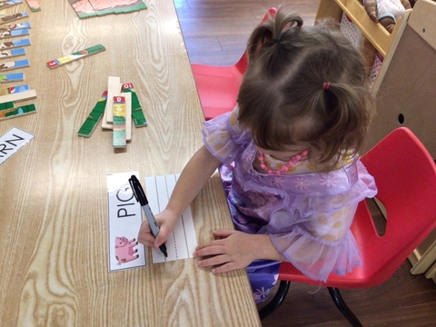 child practicing handwriting