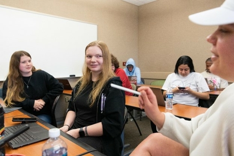 Students talking together in class