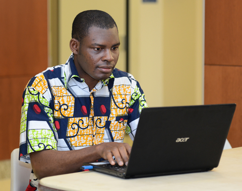 Student Looking at laptop