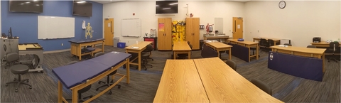 Panoramic look at SLB 104 Athletic Training Classroom. Tables and equipment storage for instruction.