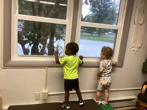 children looking out a window