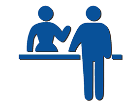 patron receiving service from a support person at a desk
