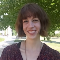 Dr. Holly Kent smiling in the UIS campus quad.