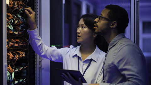 People working on computer server