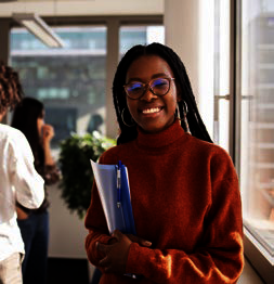 student holding a book