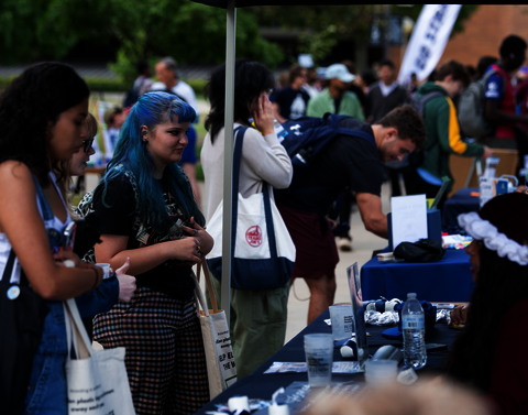Students at a table at the Involvement fair