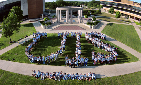 overhead shot of students spelling out UIS in front of the colonnade