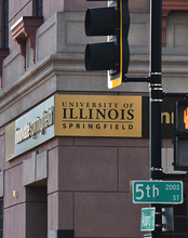 A sign on a building reads Innovate Springfield University of Illinois Springfield