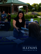 Student receiving a pamphlet