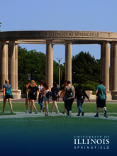 Students walk towards the colonnade.