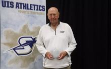 Phil Coady stands on stage with Prairie Star Pillar Award