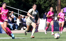 Bridget Lyons playing soccer in UIS gold