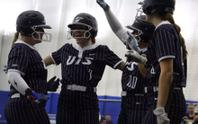 Softball celebrating a homerun